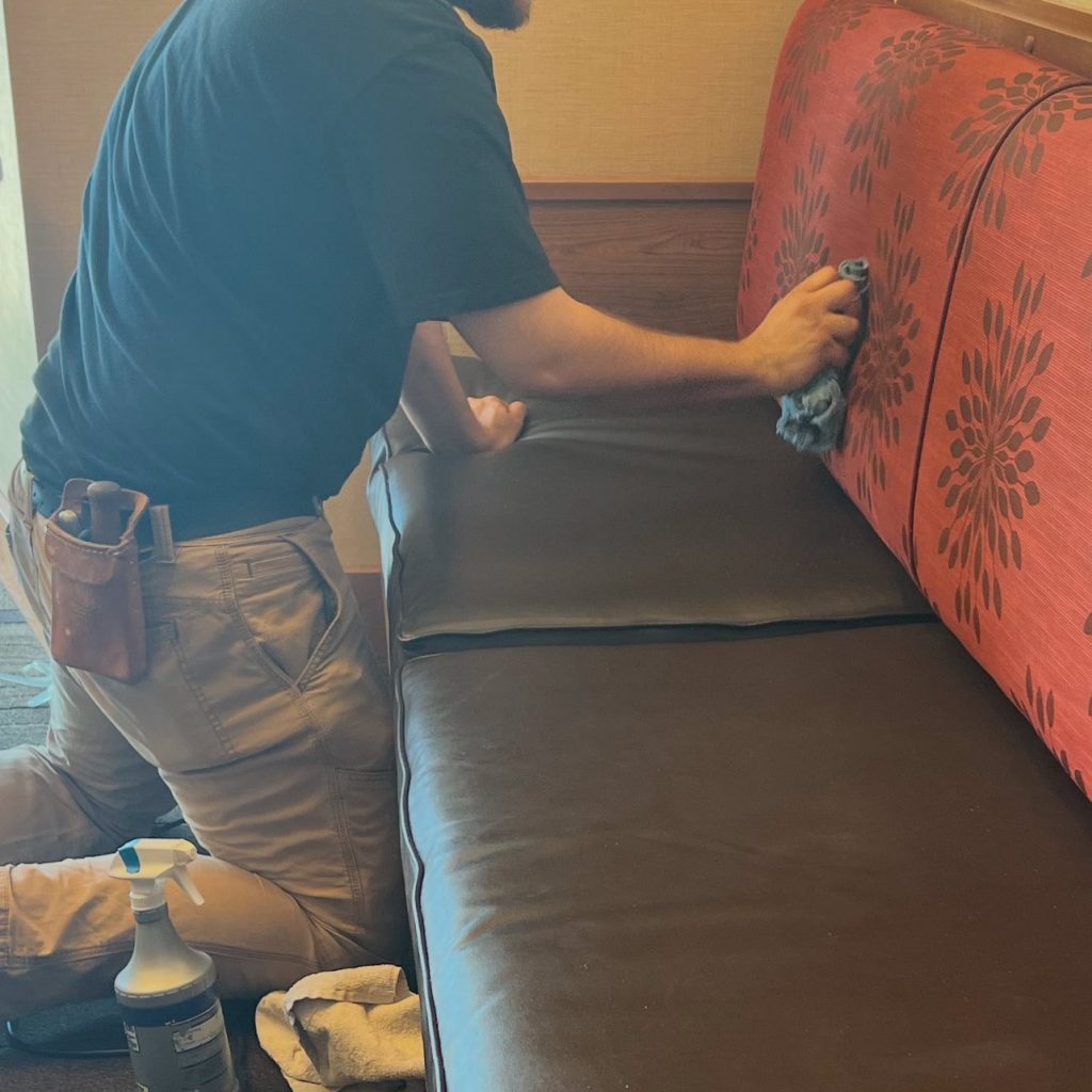 staff cleaning upholstery at a business.